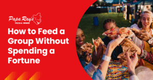 (Friends enjoying pizza outdoors, highlighting budget-friendly group meals from Papa Ray’s.)