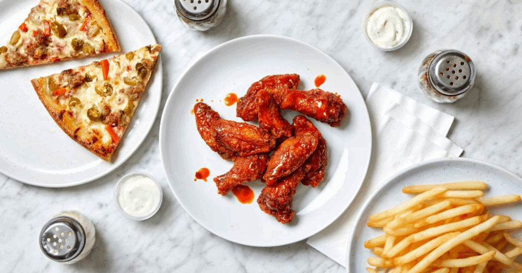 ALT: “Papa Ray’s daily special pizza bundle with wings and fries”