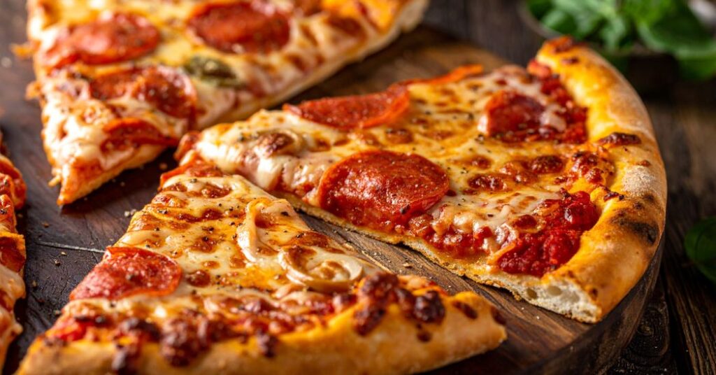 Papa Ray’s Monster Slice oversized pizza hot and fresh