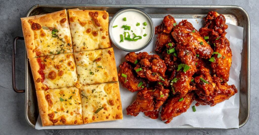 Papa Ray’s garlic bread with wings and pizza delivery near me