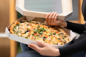 Pizza Delivery Cash Near Me: Easy Ordering and Great Value 1 Fresh pizza pie boxed up for delivery.