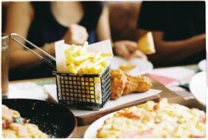 Family Pizza Deals Near Me: Delicious Meals That Everyone Can Enjoy 2 Wings and pizza combo meal plated together.